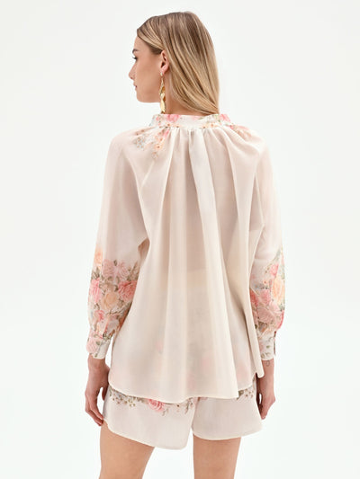 Blusa bianca con stampa floreale a rose