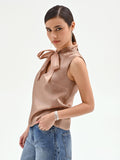 Top marrone bronzo con fiocco e punti luce