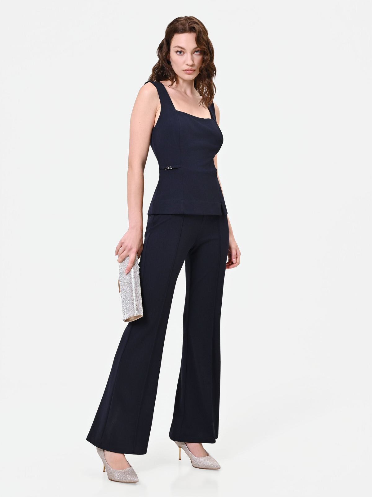 Tuta blu navy con pantalone a zampa