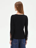 Maglia nera con inserti pizzo