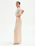 Pantalone a palazzo beige chiaro in raso cangiante