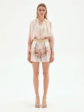 Pantalone shorts bianco a fantasia floreale