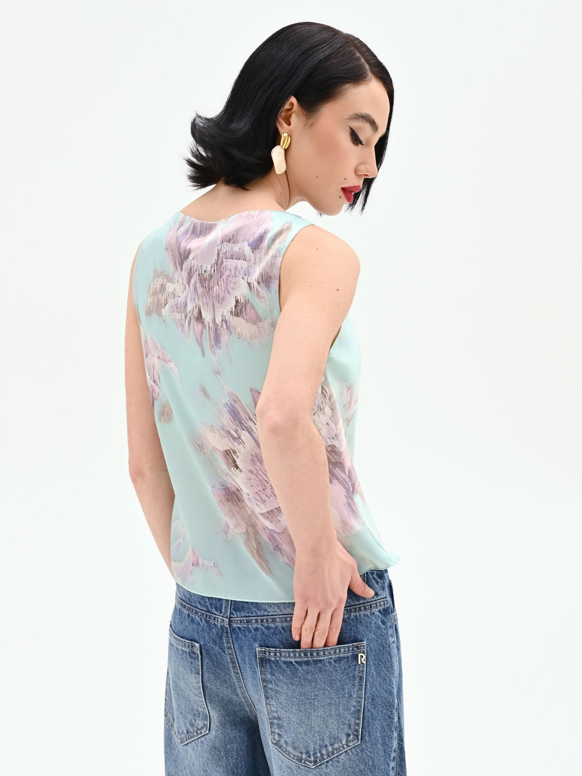 Top verde menta con stampa floreale jacquard