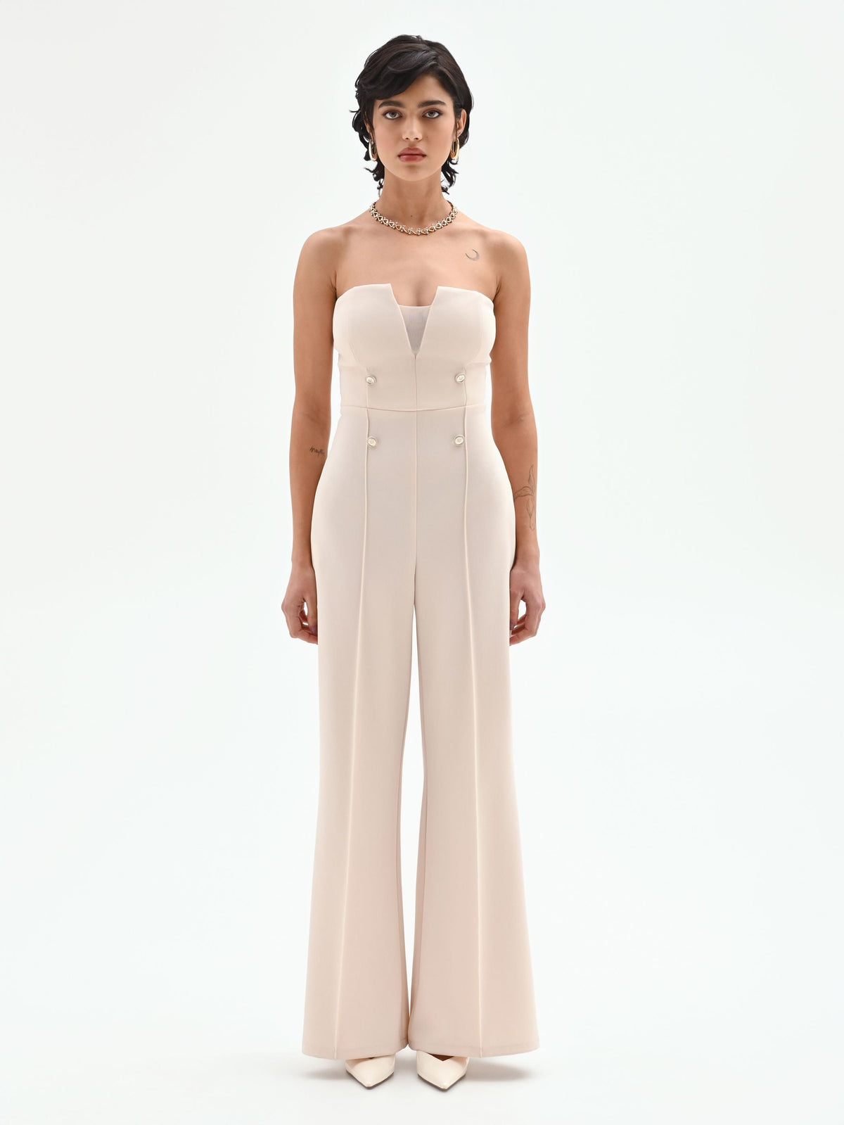 Tuta palazzo beige chiaro con bottoni e bustier