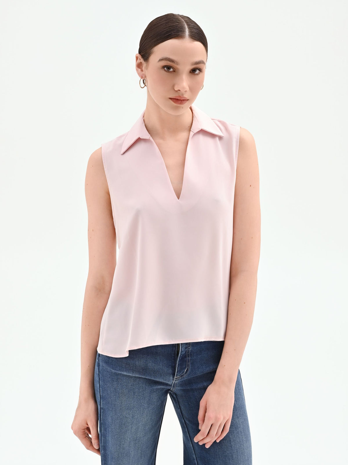 Blusa rosa pastello con collo a rever
