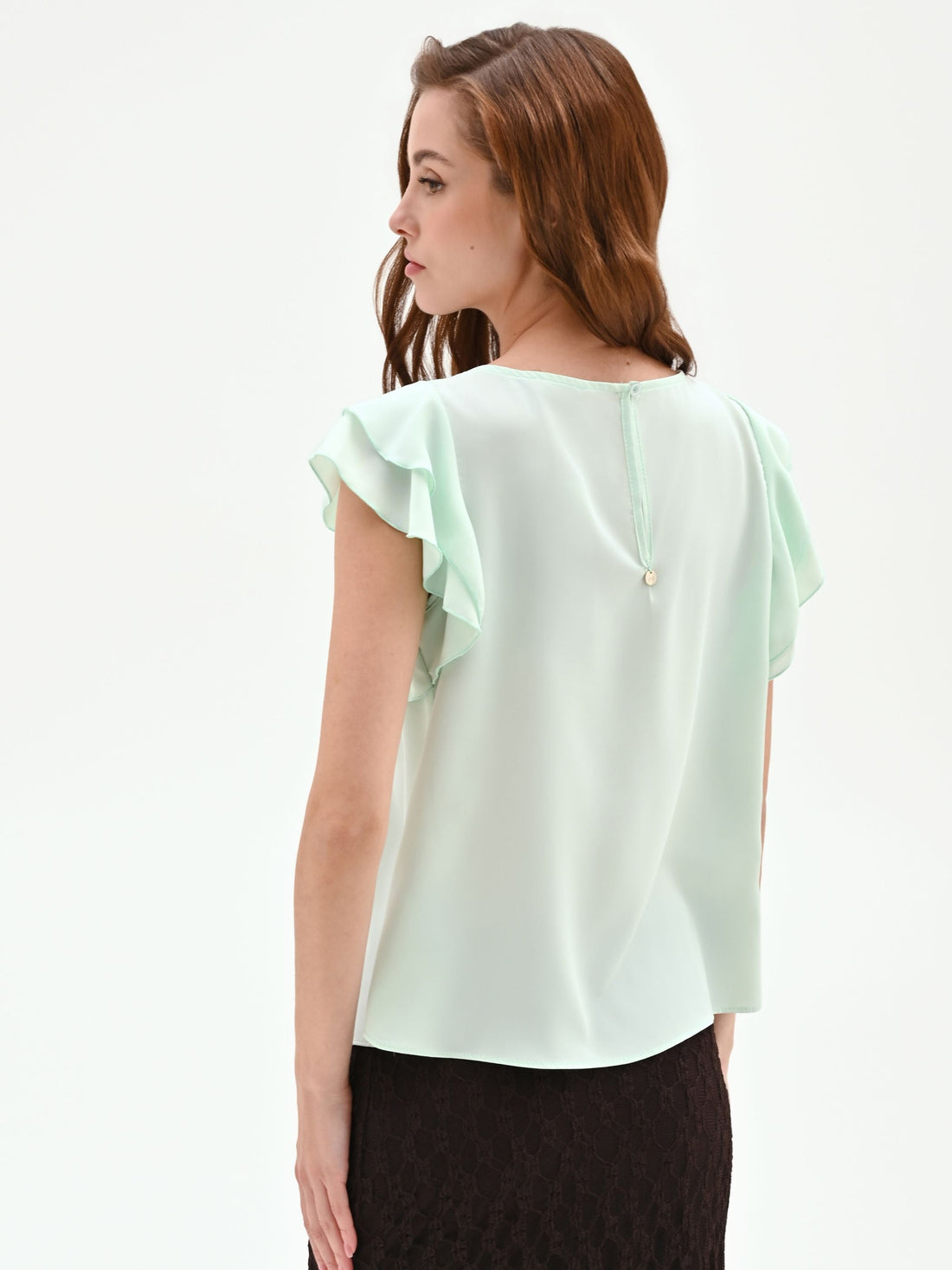 Top verde menta con maniche a volant