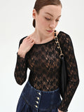 Blusa nera in pizzo floreale