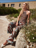 Pantalone a palazzo cioccolato con stampa botanica
