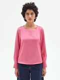 Blusa rosa con maniche a sbuffo