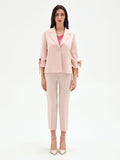 Giacca blazer rosa con fiocco sulla manica