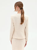 Giacca bouclé beige chiaro con fiore applicato