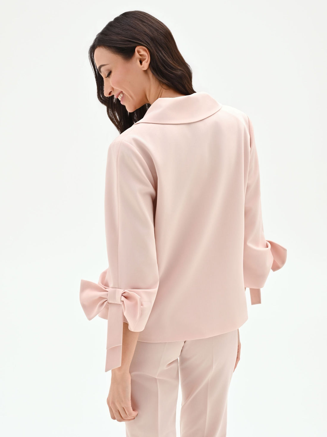 Giacca blazer rosa con fiocco sulla manica