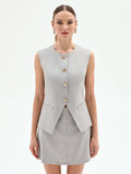 Gilet grigio sciancrato con bottoni dorati