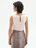 Top asimmetrico panna con accessorio oro