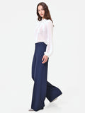 Pantalone a palazzo blu navy dalla linea fluida