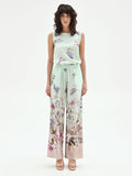 Pantalone palazzo verde menta in raso con stampa botanica