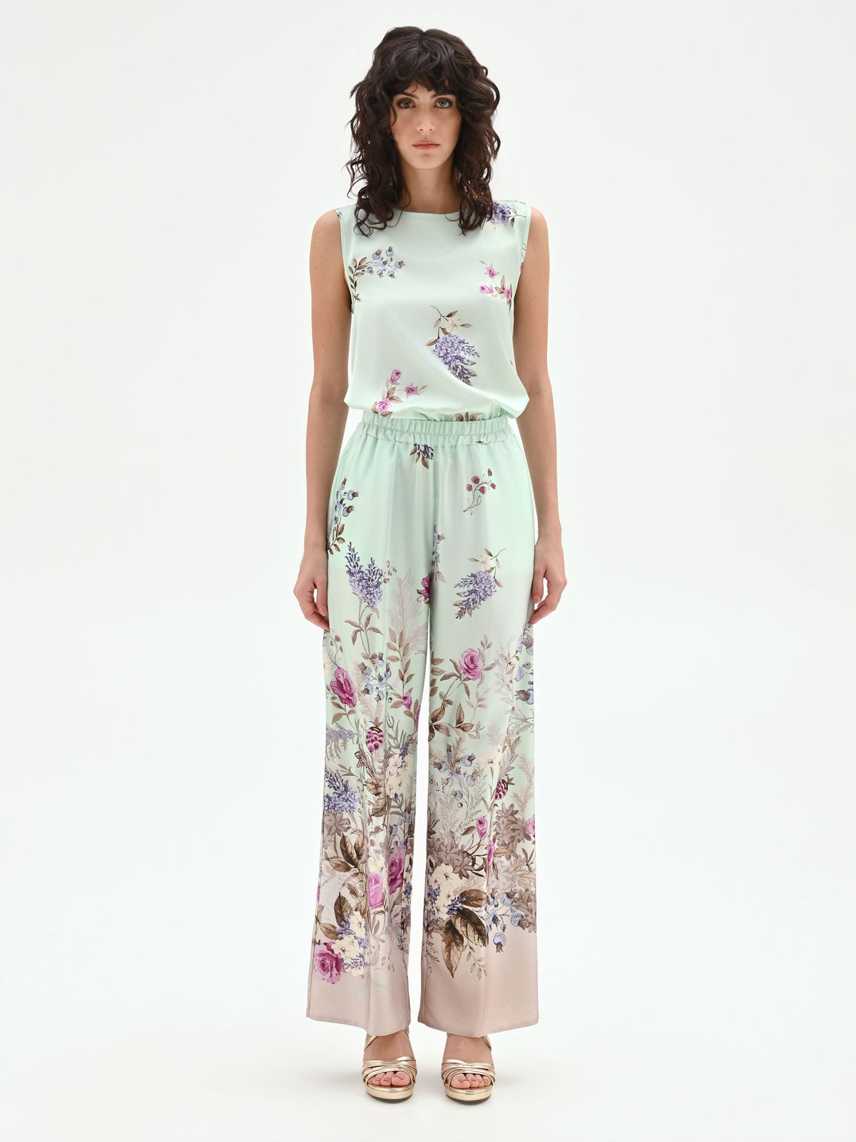 Pantalone palazzo verde menta in raso con stampa botanica
