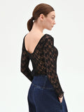 Blusa nera in pizzo floreale