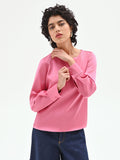 Blusa rosa con maniche a sbuffo