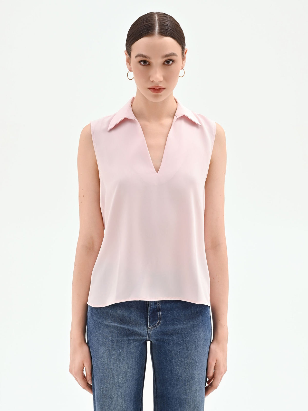 Blusa rosa pastello con collo a rever