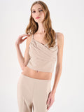 Top beige chiaro con incrocio drappeggiato