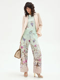 Pantalone palazzo verde menta in raso con stampa botanica