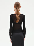 Blusa nera con drappeggio laterale
