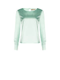Blusa verde menta dalla linea essenziale