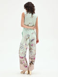 Pantalone palazzo verde menta in raso con stampa botanica