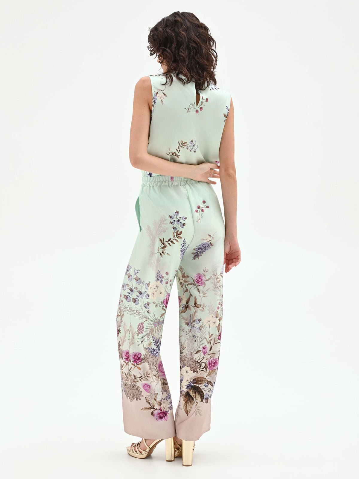 Pantalone palazzo verde menta in raso con stampa botanica