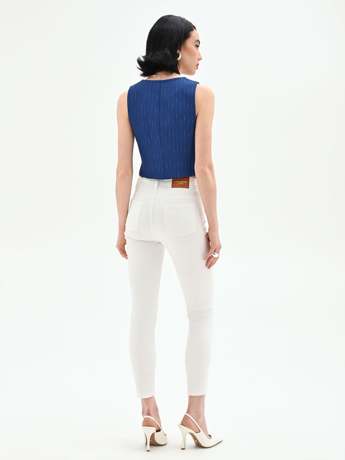 Jeans bianchi skinny con bottoni laterali