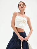 Top crop panna con maxi fiocco