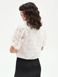 Blusa bianca in organza con maxi fiori applicati