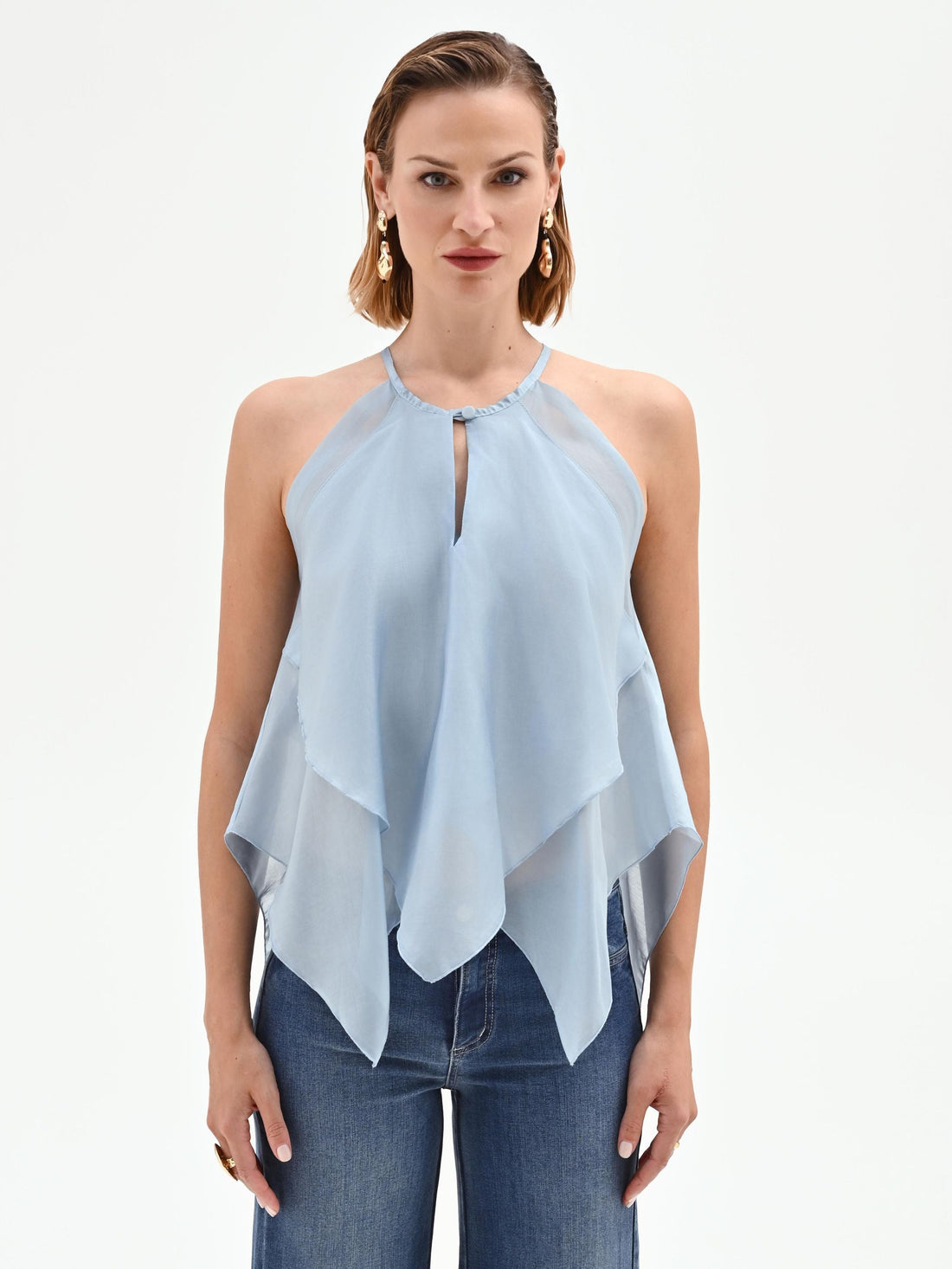 Top cielo azzurro con balze asimmetriche