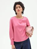 Blusa rosa con maniche a sbuffo
