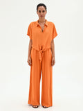 Camicia arancione in lino con nodo