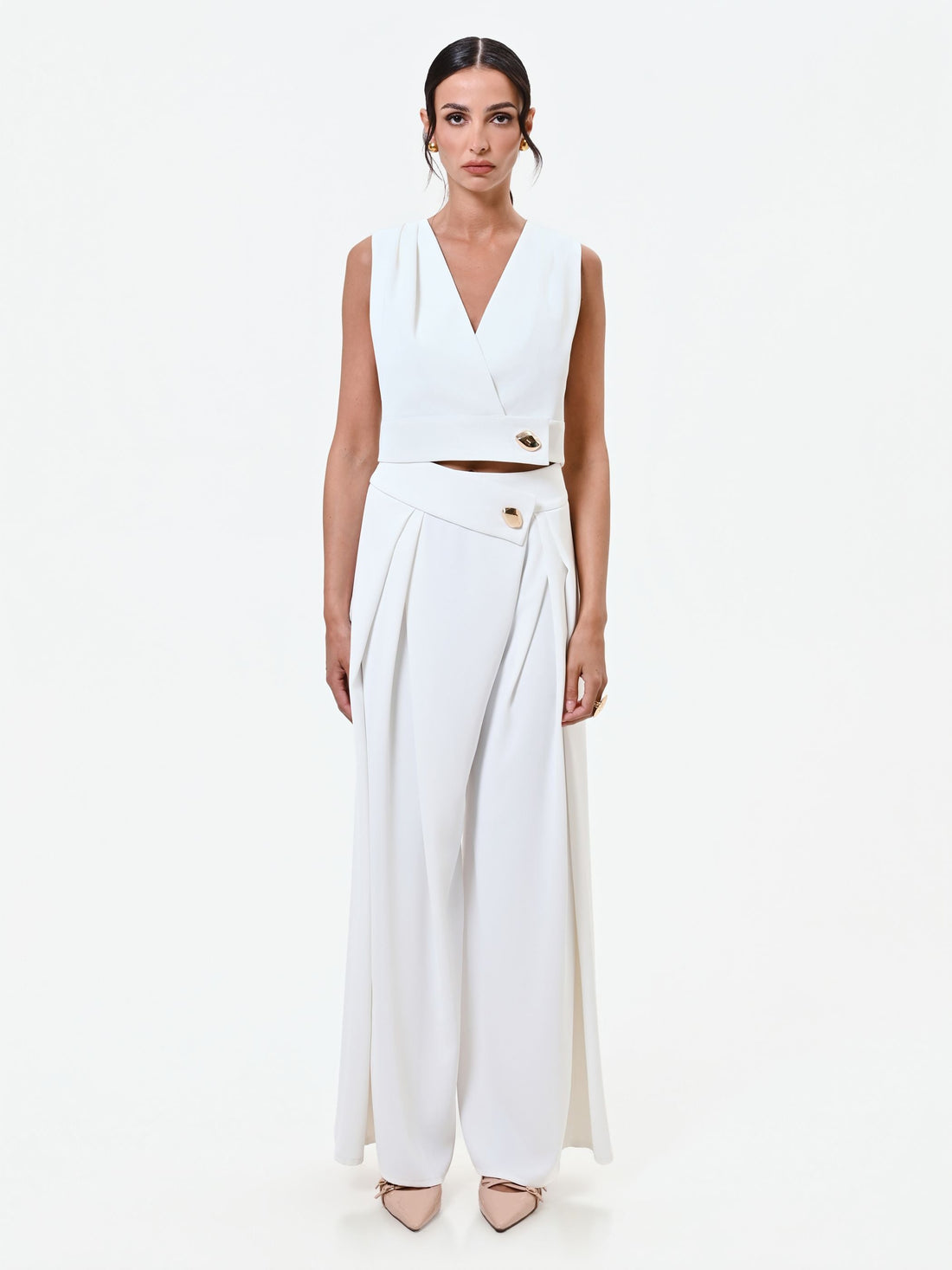 Gilet bianco cropped con bottone design
