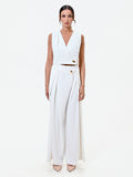Gilet bianco cropped con bottone design