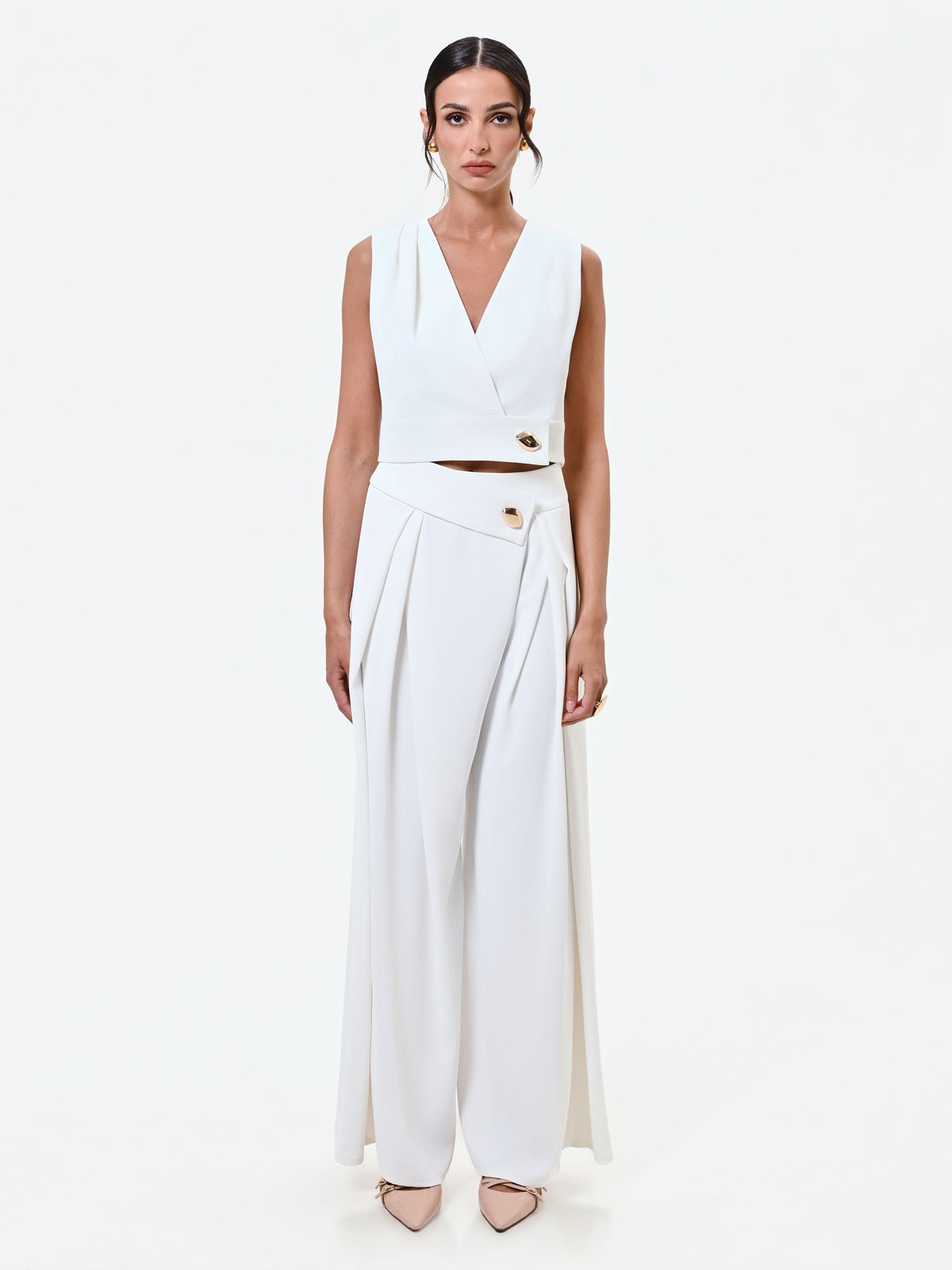 Gilet bianco cropped con bottone design