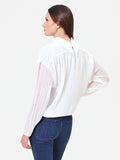 Blusa panna a maniche lunghe con plissettatura