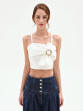 Top crop panna con maxi fiocco