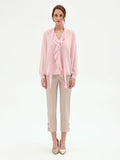 Blusa rosa chiaro con rouche e nastro lavalliere