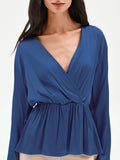 Blusa blu brillante con drappeggio
