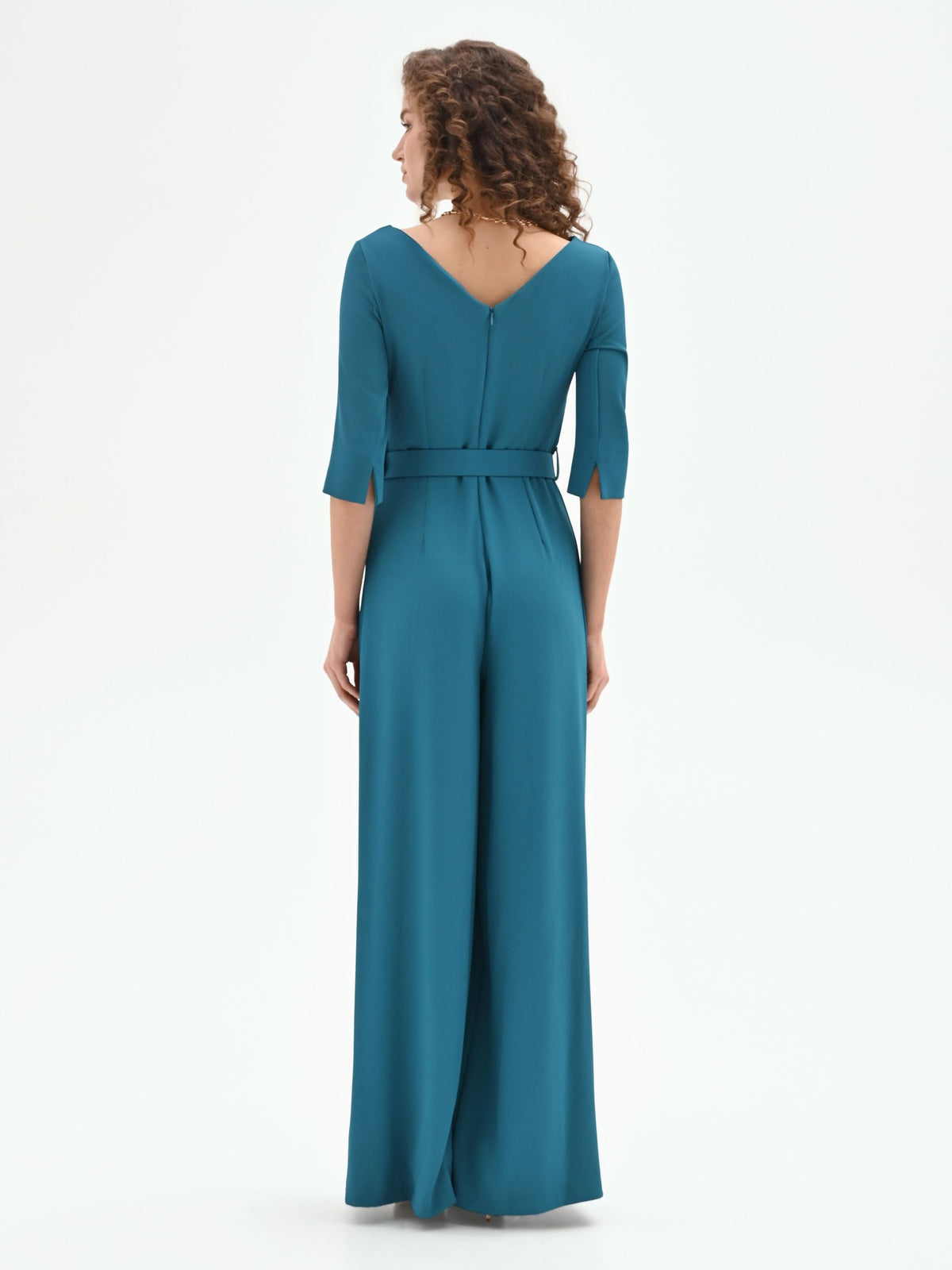 Tuta verde ottanio con scollo drappeggiato