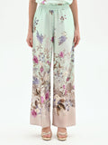 Pantalone palazzo verde menta in raso con stampa botanica