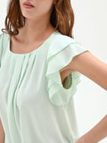 Top verde menta con maniche a volant