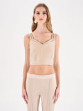 Top crop beige chiaro con doppie spalline