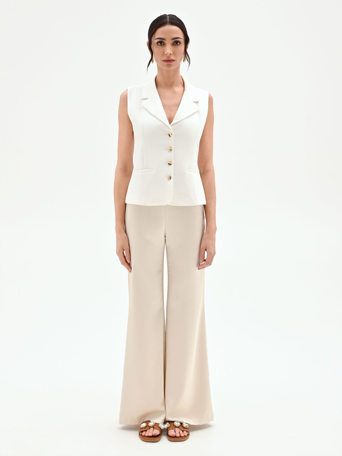 Gilet panna con bottoni design oro