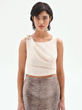 Top asimmetrico panna con accessorio oro