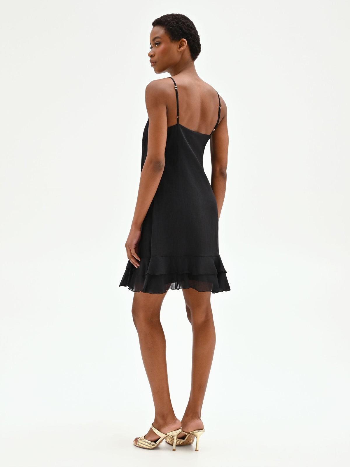 Mini abito nero in lyocell con rose applicate e balze